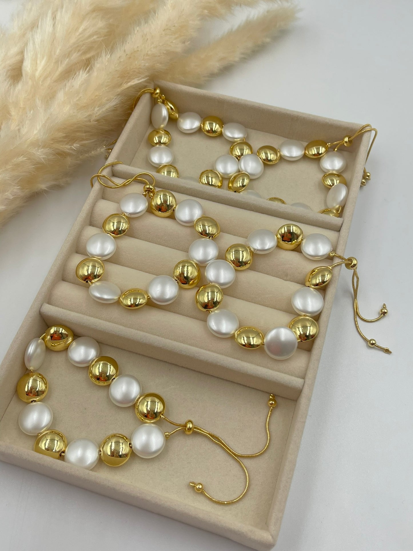 Gold and White Beaded Bracelets