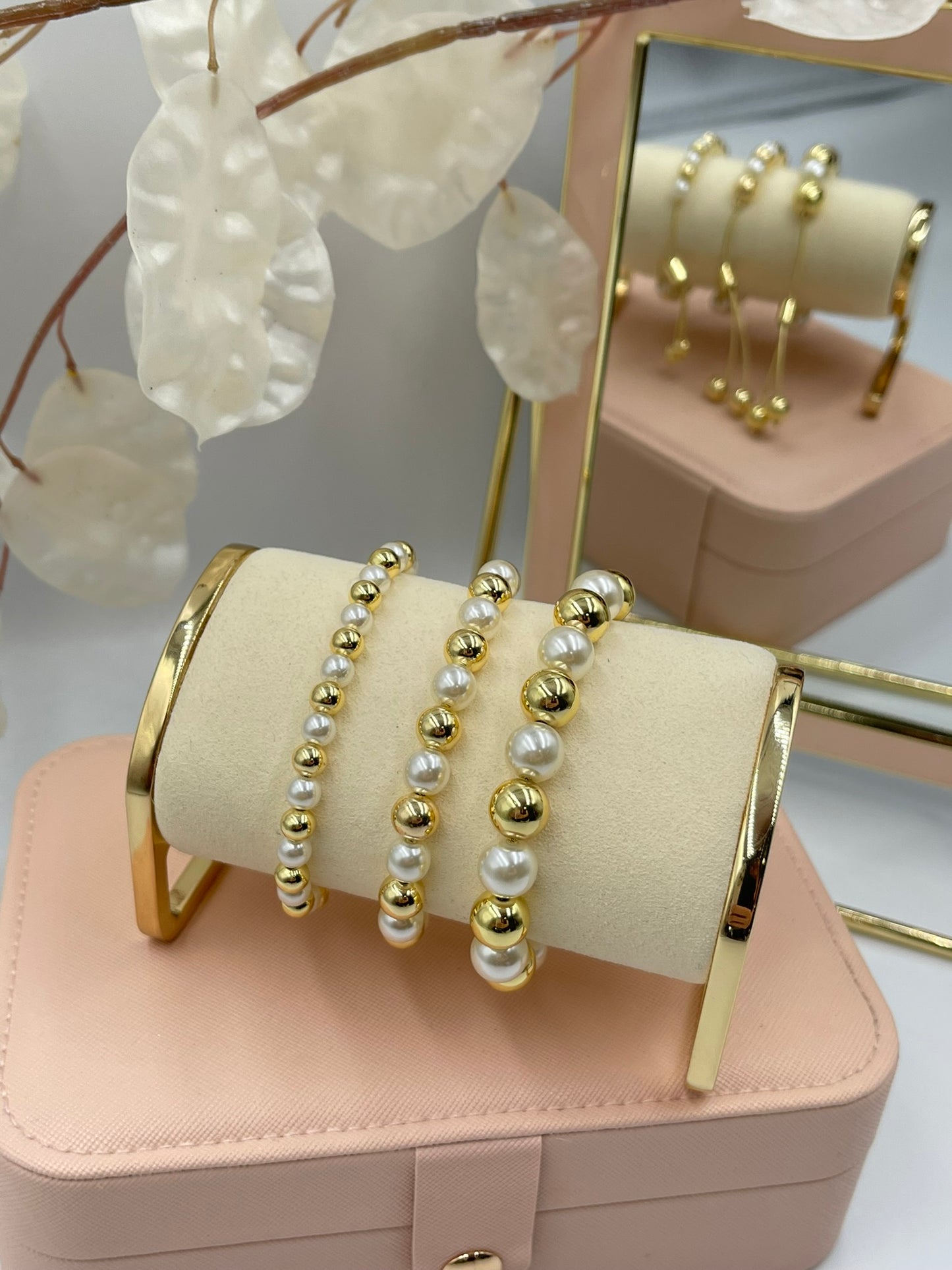 Gold and Pearl Bracelets